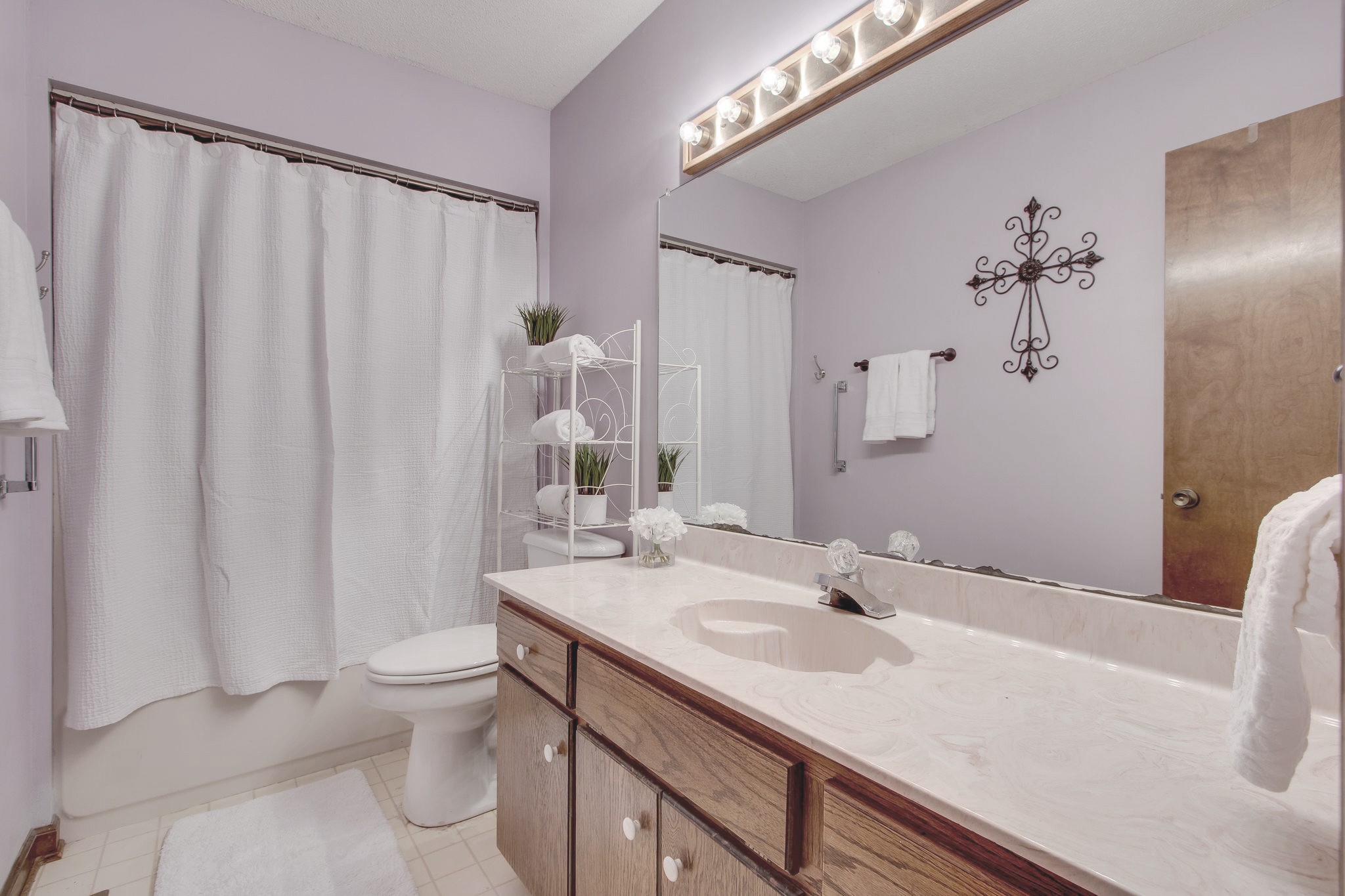 207 Eaton Heights Manchester, TN 37355 - Photo 26 of 37 a bathroom with a granite countertop sink and a mirror