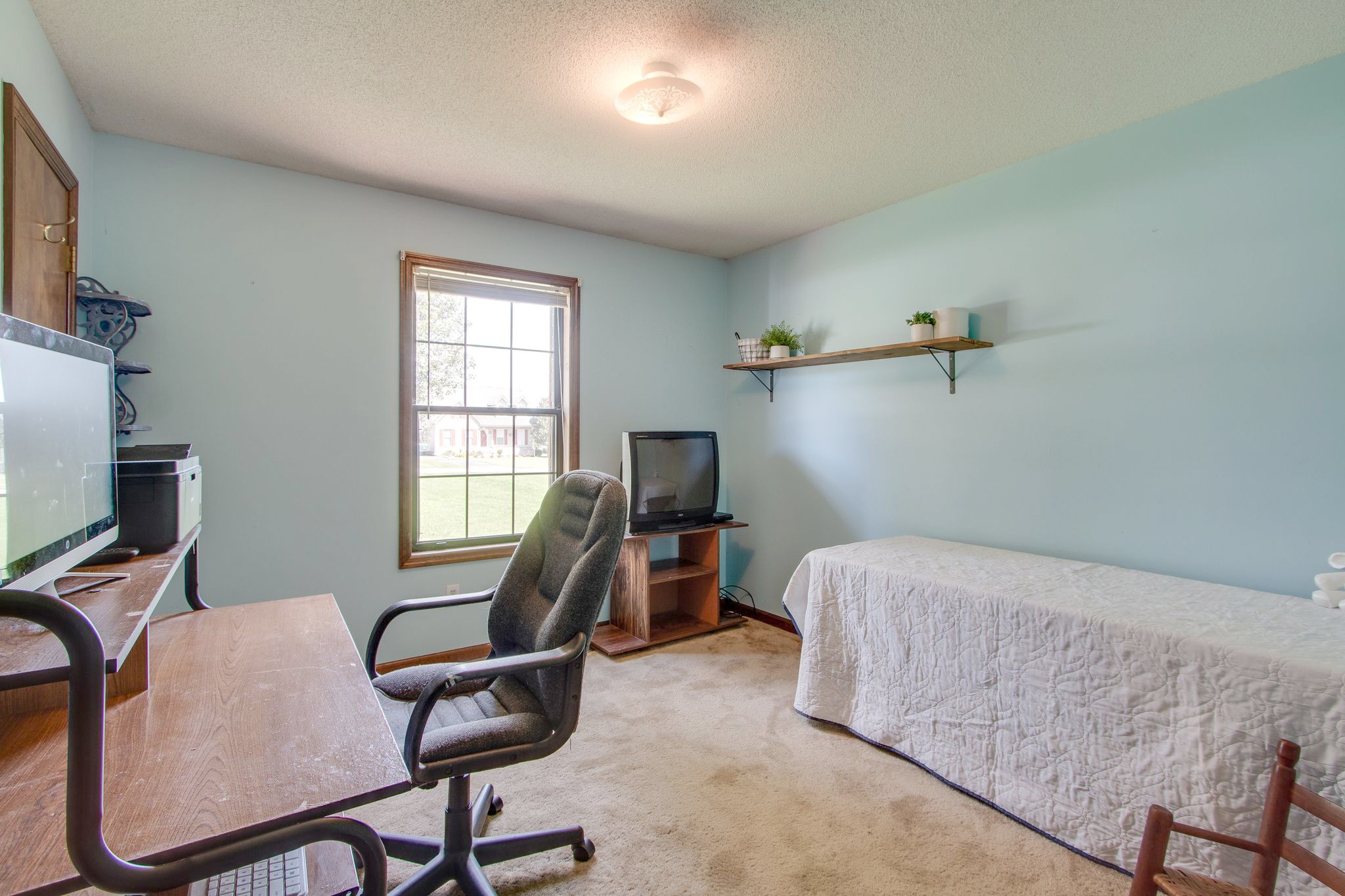 207 Eaton Heights Manchester, TN 37355 - Photo 27 of 37 a bedroom with a bed a desk and chair