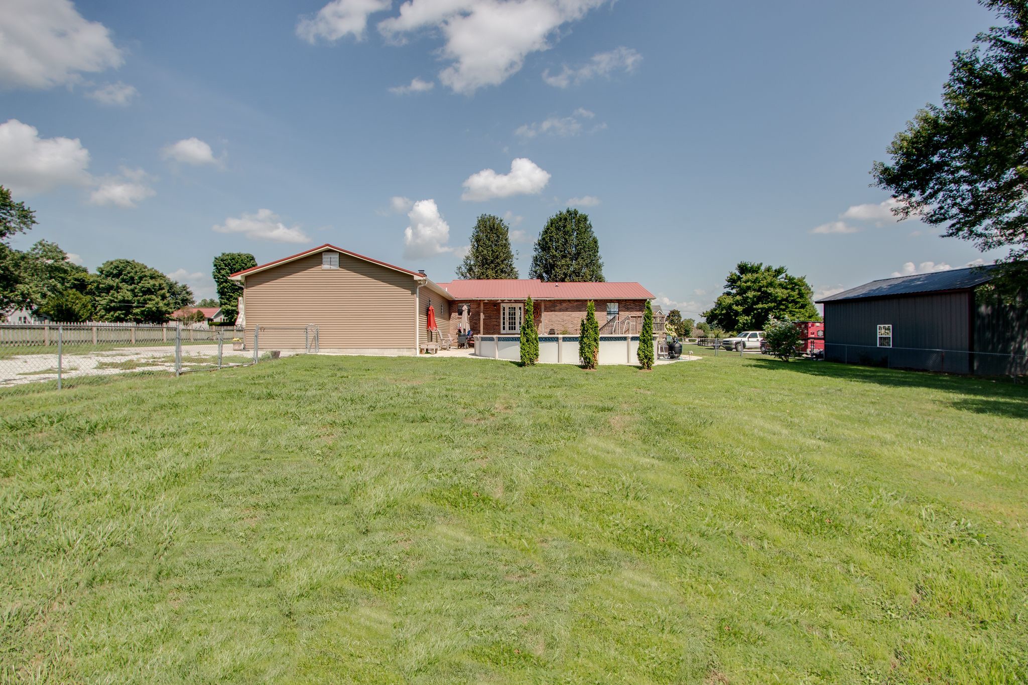 207 Eaton Heights Manchester, TN 37355 - Photo 35 of 37 a view of a house with a yard and garage