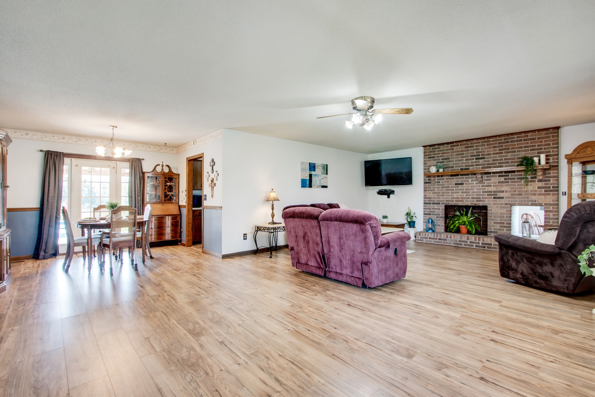 207 Eaton Heights Manchester, TN 37355 - Photo 6 of 37 a living room with furniture a fireplace and a table