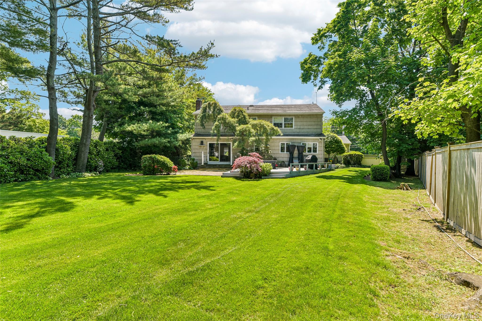 100 Hewlett Neck Road Woodmere, NY 11598 - Photo 4 of 45 a view of a house with a big yard