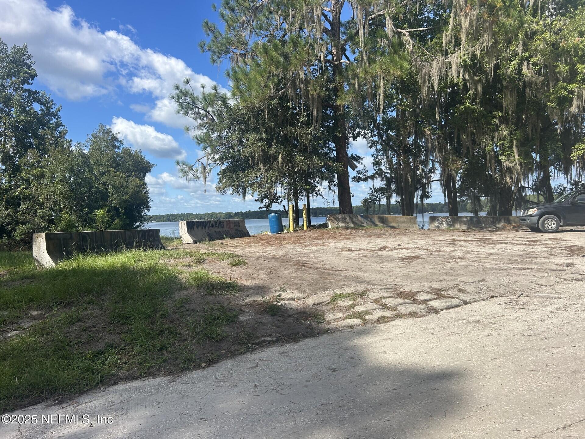 100 Georges Lake Boat Ramp Road Florahome, FL 32140 - Photo 7 of 12 a backyard of a house with lots of green space