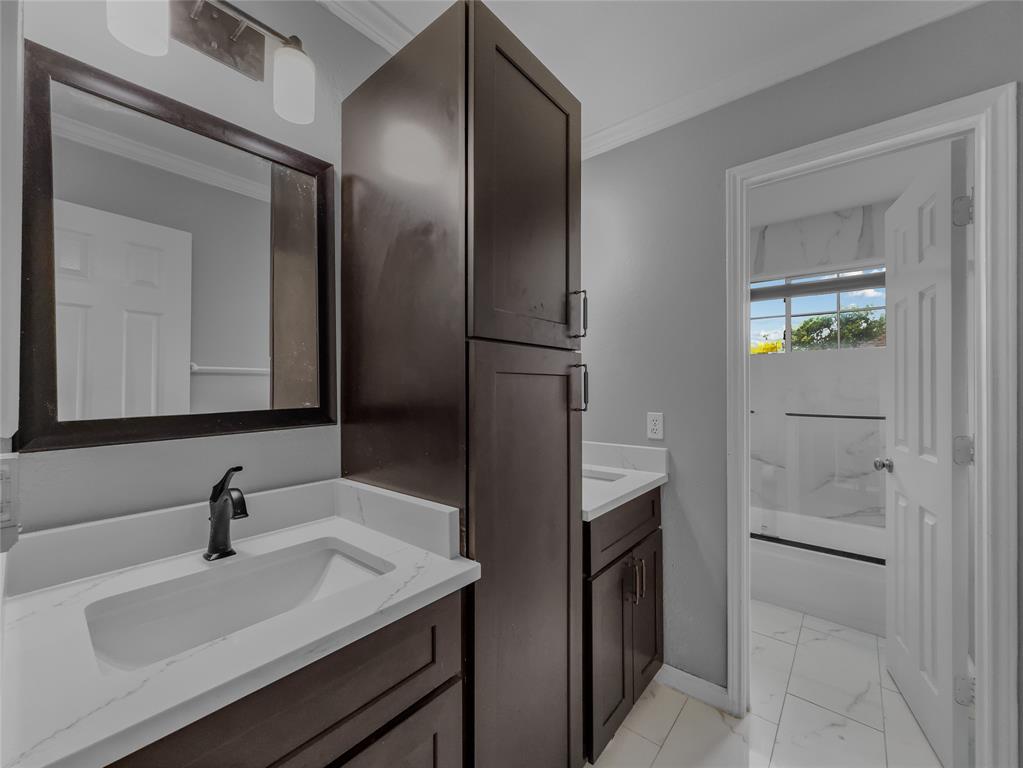 2317 Wellesly Road Rowlett, TX 75089 - Photo 30 of 39 a bathroom with a sink and a mirror
