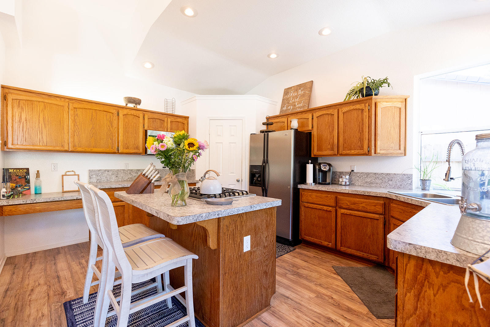 3363 Lawrence Road Redding, CA 96002 - Photo 12 of 33 a dining table with chairs and cabinets