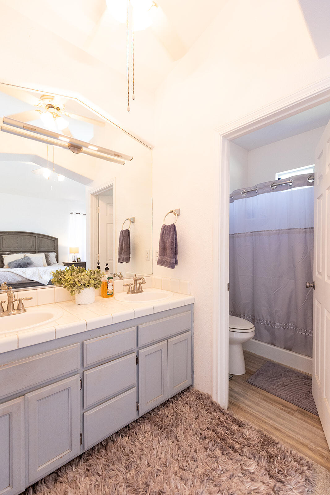 3363 Lawrence Road Redding, CA 96002 - Photo 19 of 33 a bathroom with a double vanity sink toilet and shower
