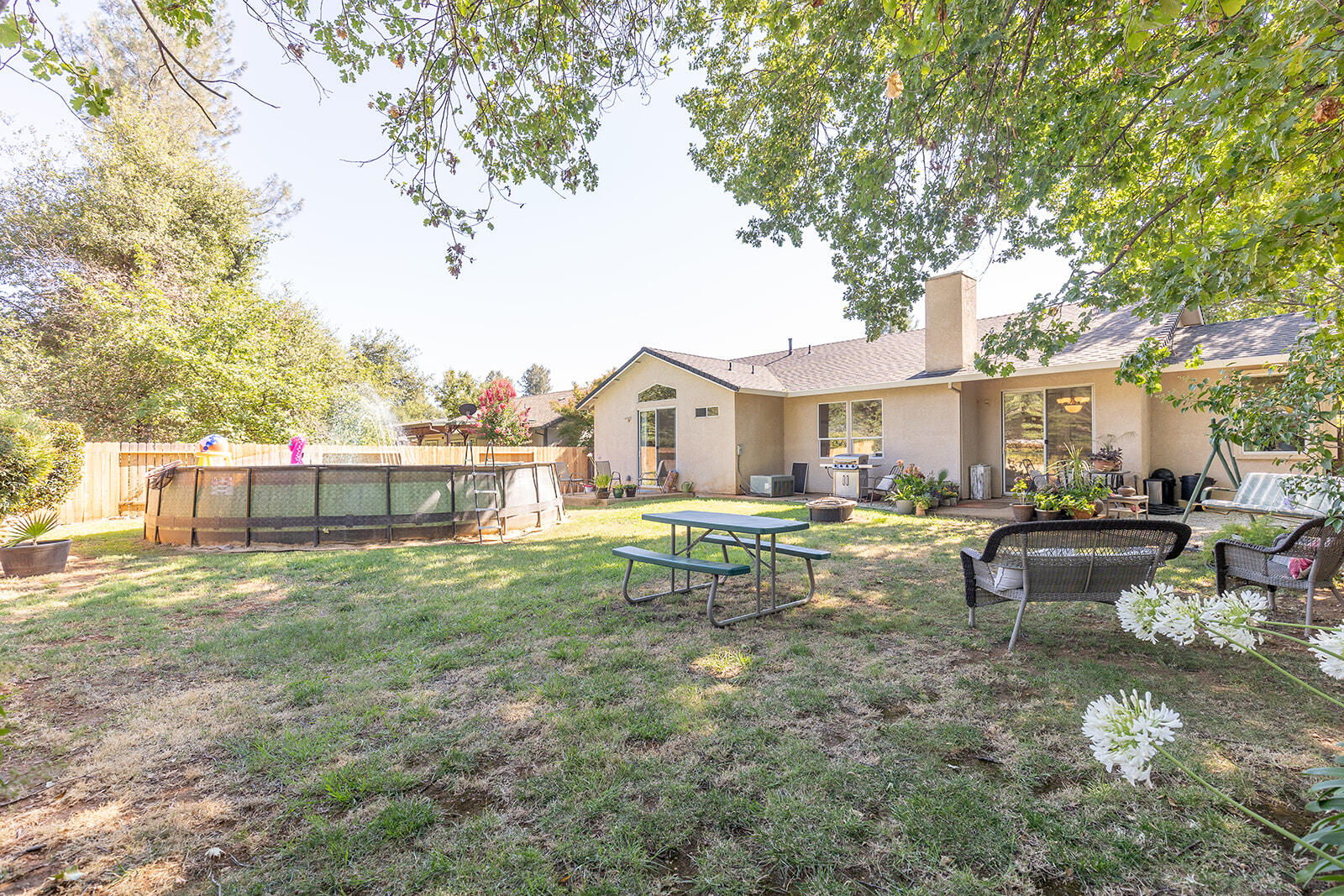3363 Lawrence Road Redding, CA 96002 - Photo 29 of 33 a view of a house with backyard and sitting area