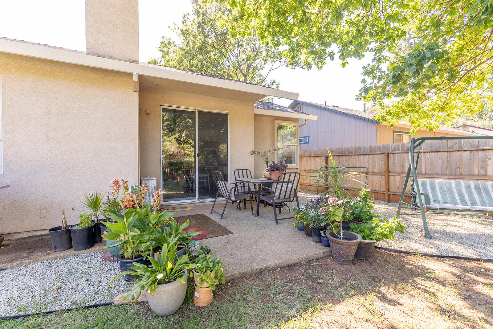 3363 Lawrence Road Redding, CA 96002 - Photo 33 of 33 a garden with a table and chairs in patio