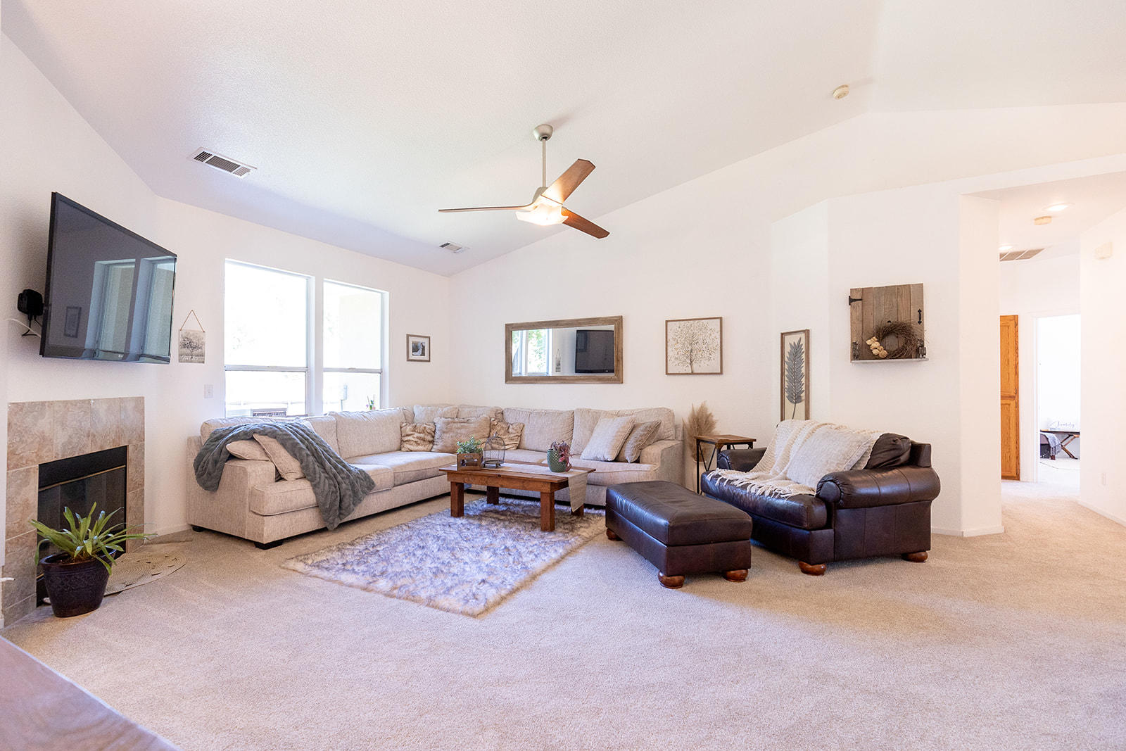3363 Lawrence Road Redding, CA 96002 - Photo 6 of 33 a living room with furniture a fireplace and a flat screen tv