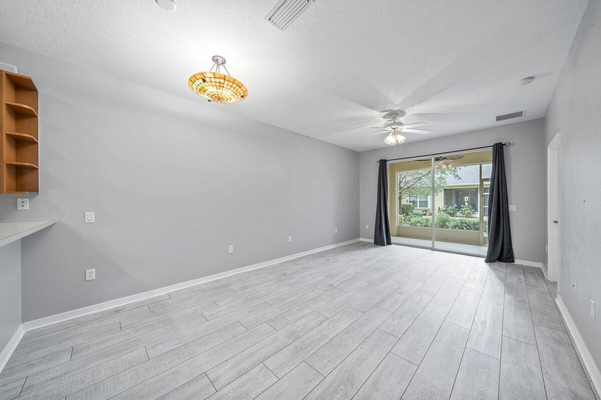 2980 Le Conte Street Melbourne, FL 32940 - Photo 16 of 25 wooden floor in an empty room with a window