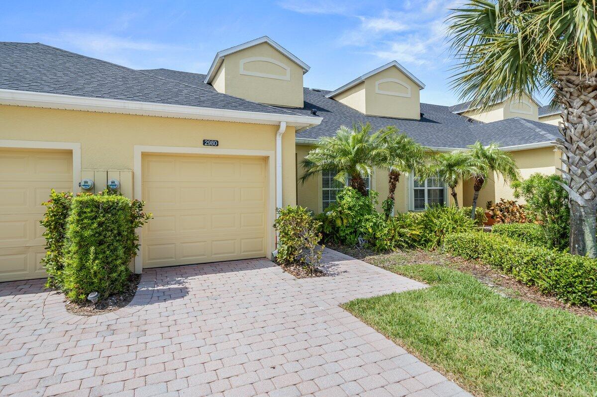 2980 Le Conte Street Melbourne, FL 32940 - Photo 2 of 25 a front view of a house with garden