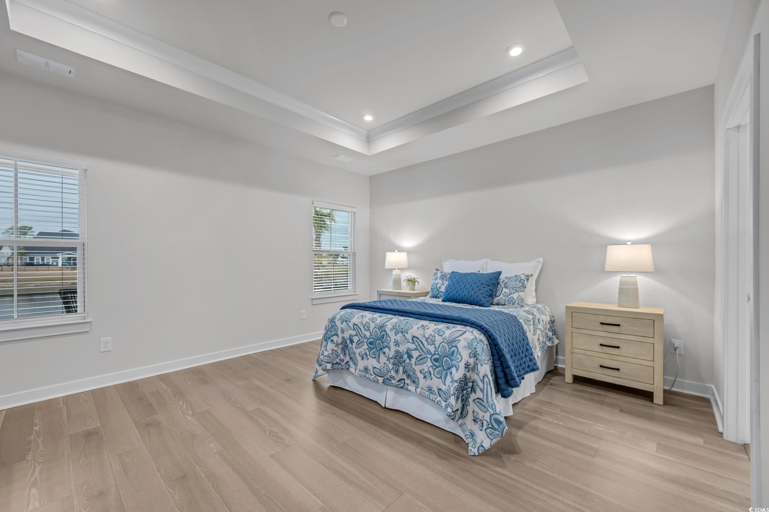 Living room with light hardwood / wood-style floor