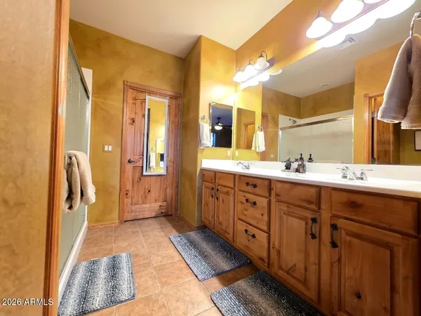 a bathroom with a toilet a sink and shower