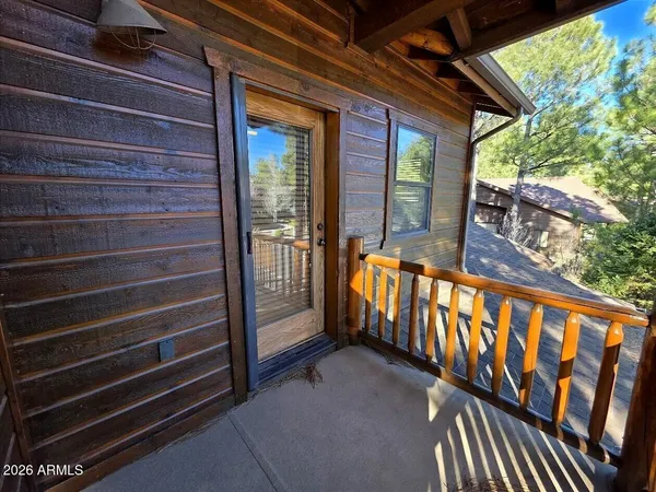 a view of a patio with table and chairs