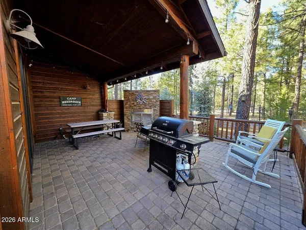 a outdoor space with chairs a table and chairs