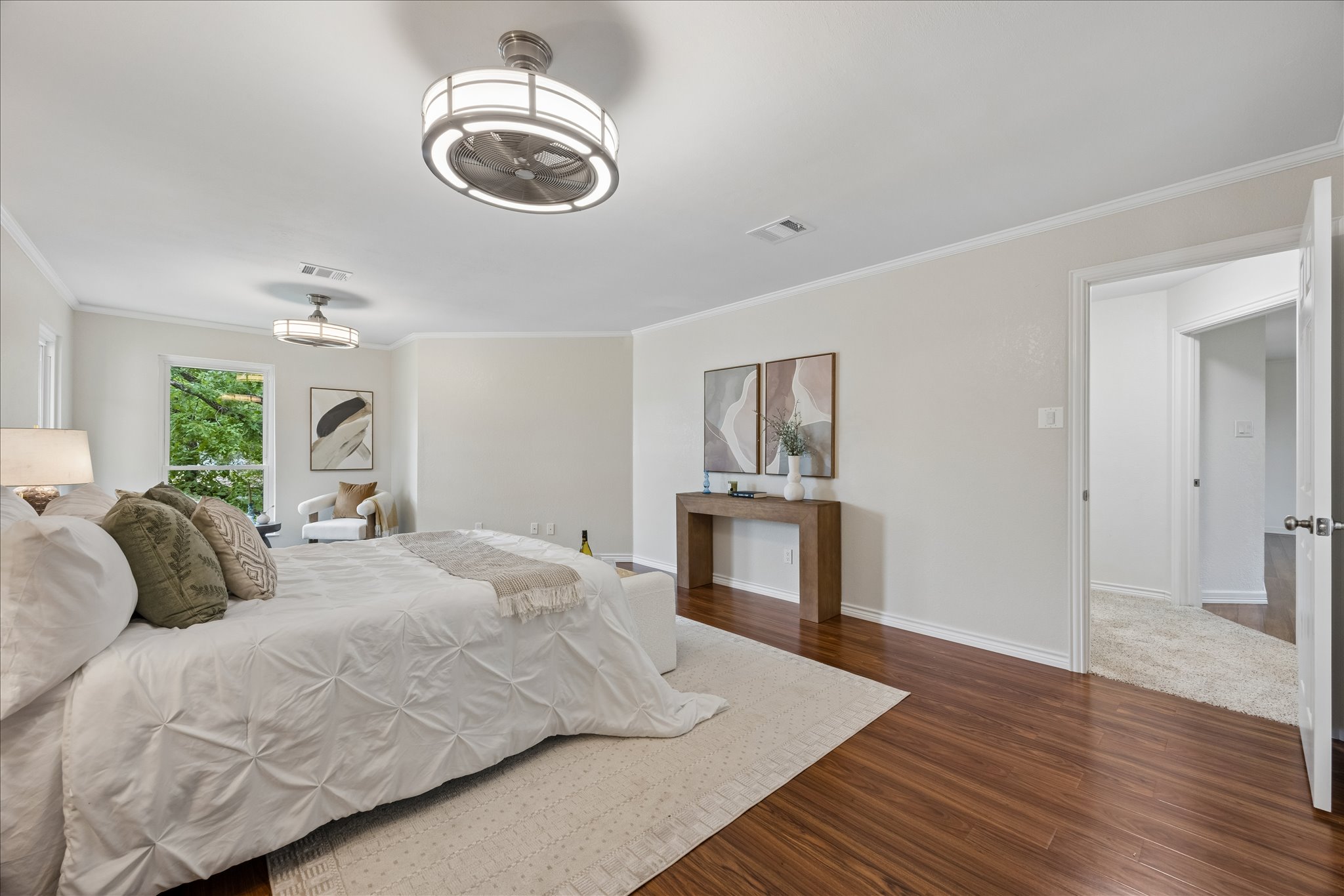 1306 Shady Grove Path Cedar Park, TX 78613 - Photo 18 of 40 a bedroom with a bed and a chandelier