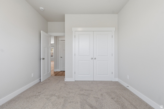 677 East 800 S Street Springville, UT 84663 - Photo 27 of 35 Unfurnished bedroom with light colored carpet and a closet