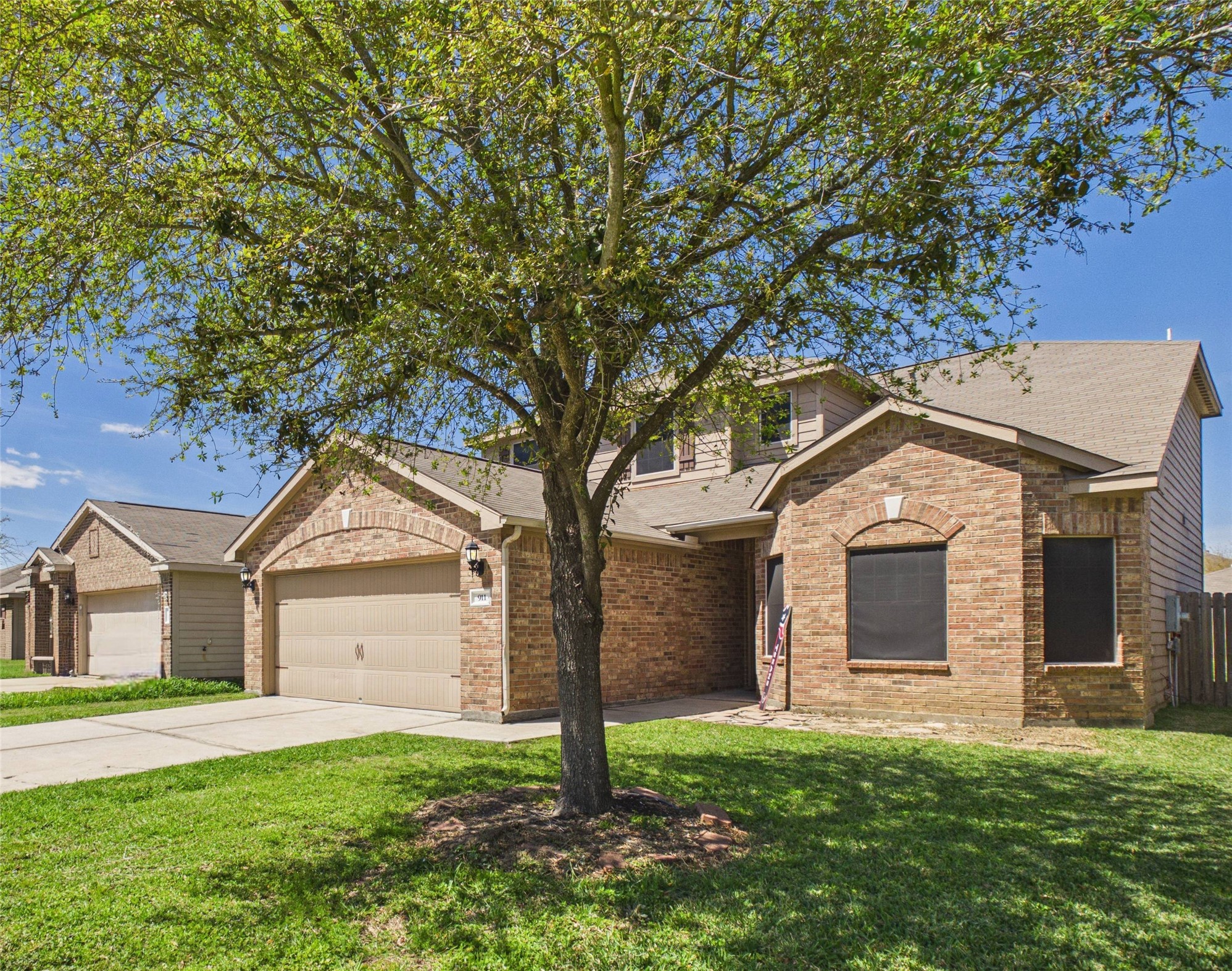 911 Marigold Road Baytown, TX 77521 - Photo 1 of 33 Discover comfort in this inviting brick home, with a spacious garage and a welcoming entrance.