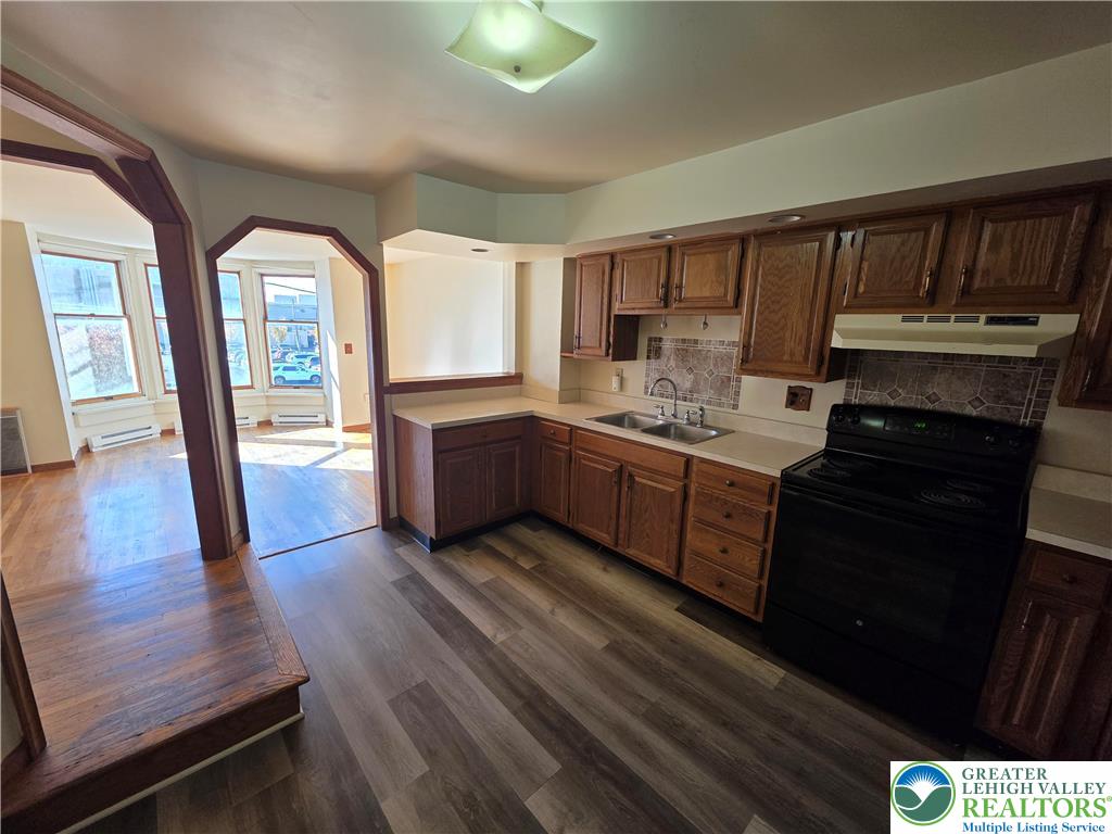 337 North 16th Street, Unit 2 Allentown, PA 18102 - Photo 2 of 13 a kitchen with a sink and wooden floor