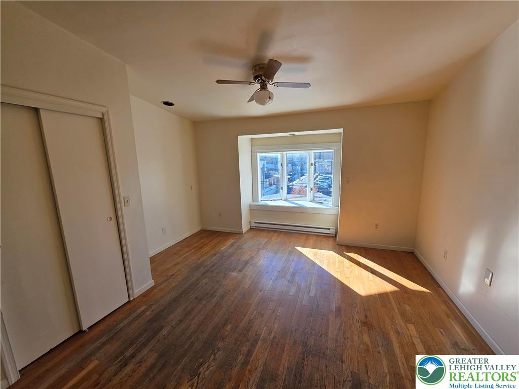 337 North 16th Street, Unit 2 Allentown, PA 18102 - Photo 6 of 13 wooden floor in an empty room with a window