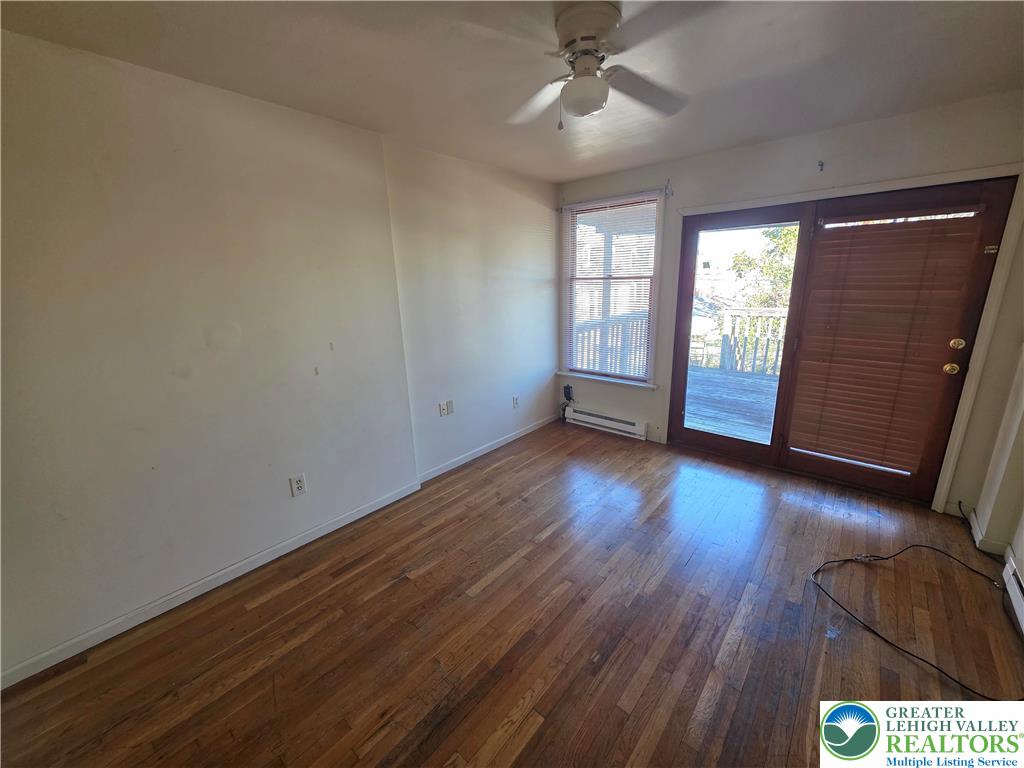337 North 16th Street, Unit 2 Allentown, PA 18102 - Photo 7 of 13 an empty room with wooden floor and windows