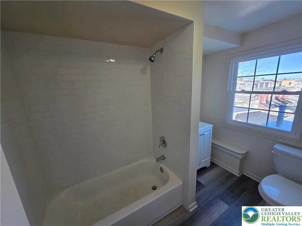 337 North 16th Street, Unit 2 Allentown, PA 18102 - Photo 10 of 13 a bathroom with a bathtub toilet and window
