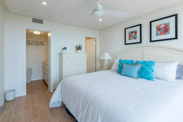 a bedroom with a bed and a cabinets