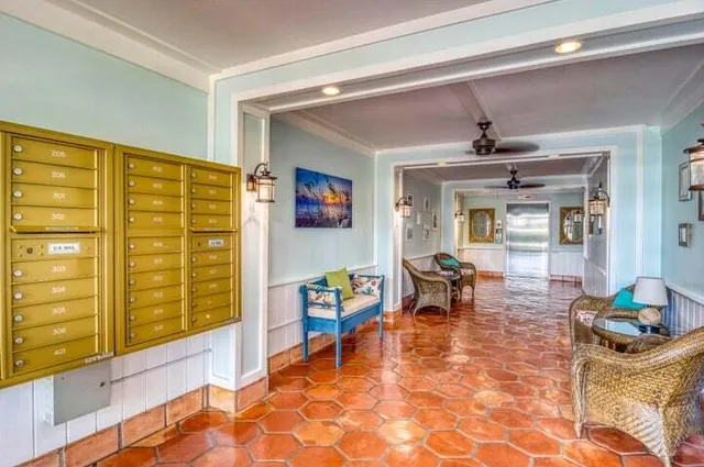 a living room with patio furniture and a window