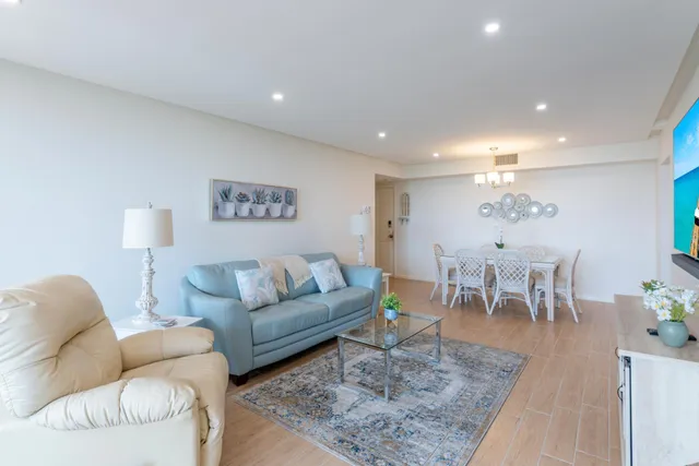 a living room with furniture and a rug
