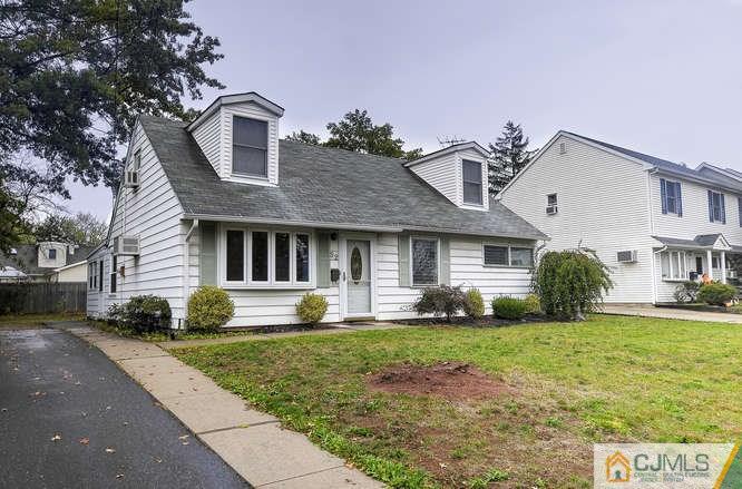 52 Sturgis Road Edison, NJ 08817 - Photo 2 of 22 a front view of a house with a yard and garage