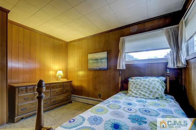 52 Sturgis Road Edison, NJ 08817 - Photo 11 of 22 a bedroom with a bed and wooden floor