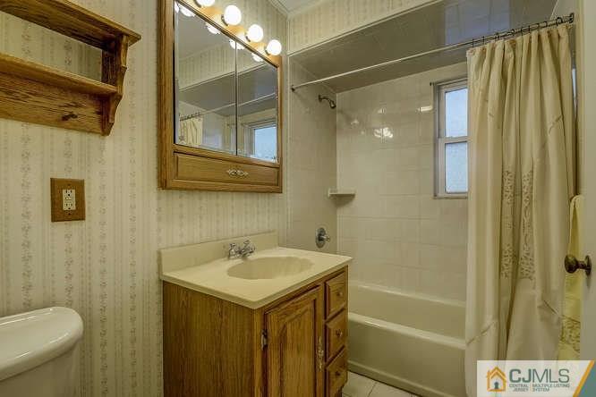 52 Sturgis Road Edison, NJ 08817 - Photo 12 of 22 a bathroom with a sink and a mirror