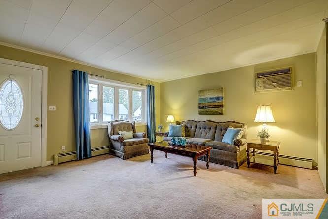 52 Sturgis Road Edison, NJ 08817 - Photo 13 of 22 a living room with furniture and a window