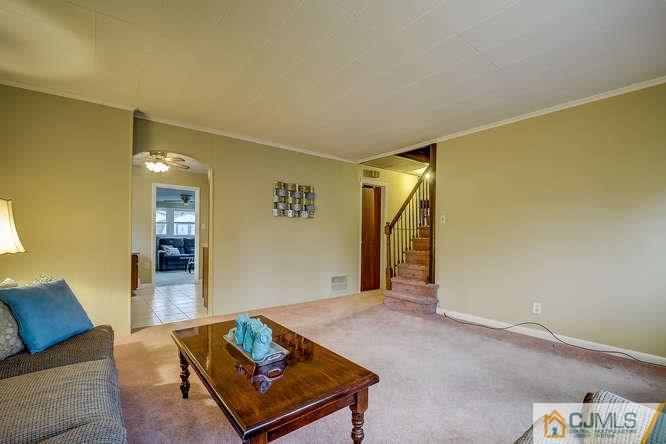 52 Sturgis Road Edison, NJ 08817 - Photo 15 of 22 a living room with furniture and a rug