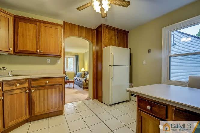 52 Sturgis Road Edison, NJ 08817 - Photo 17 of 22 a kitchen with stainless steel appliances granite countertop a refrigerator a stove and a sink with granite countertops