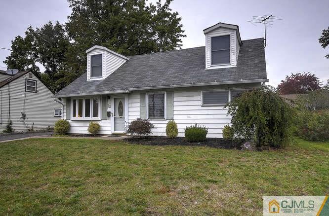 52 Sturgis Road Edison, NJ 08817 - Photo 3 of 22 a front view of a house with a garden
