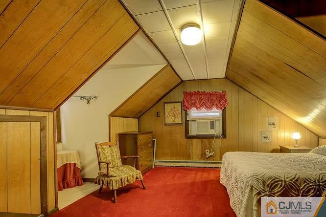 52 Sturgis Road Edison, NJ 08817 - Photo 22 of 22 a bedroom with a bed and chair