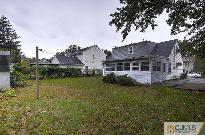 52 Sturgis Road Edison, NJ 08817 - Photo 4 of 22 a front view of a house with garden