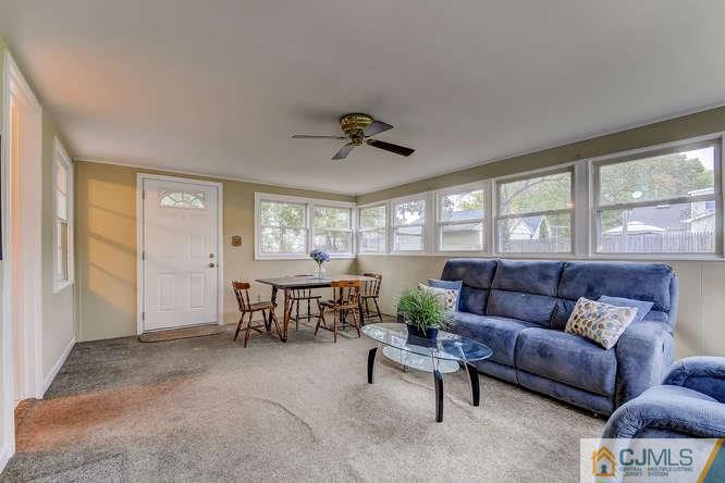 52 Sturgis Road Edison, NJ 08817 - Photo 8 of 22 a living room with furniture and a large window