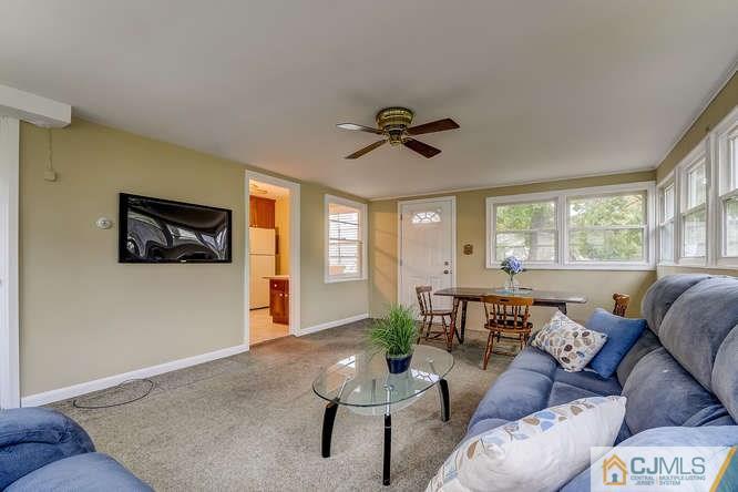 52 Sturgis Road Edison, NJ 08817 - Photo 9 of 22 a living room with furniture and a window