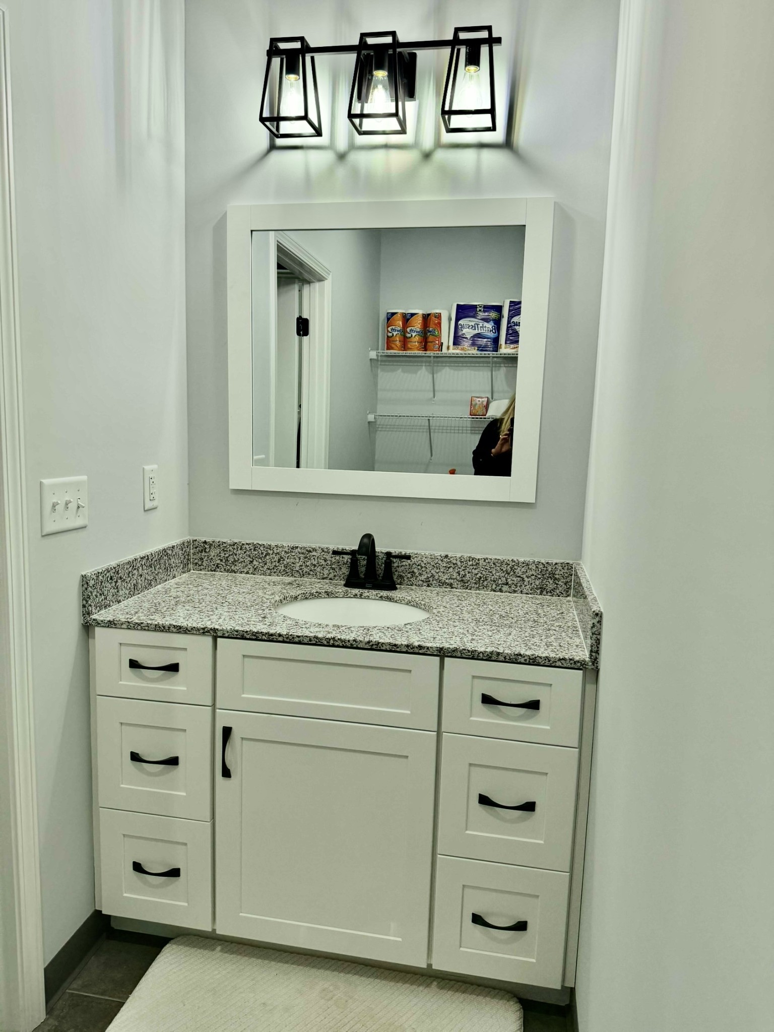 9461 Short Mountain Road Smithville, TN 37166 - Photo 13 of 26 a bathroom with a sink and a mirror