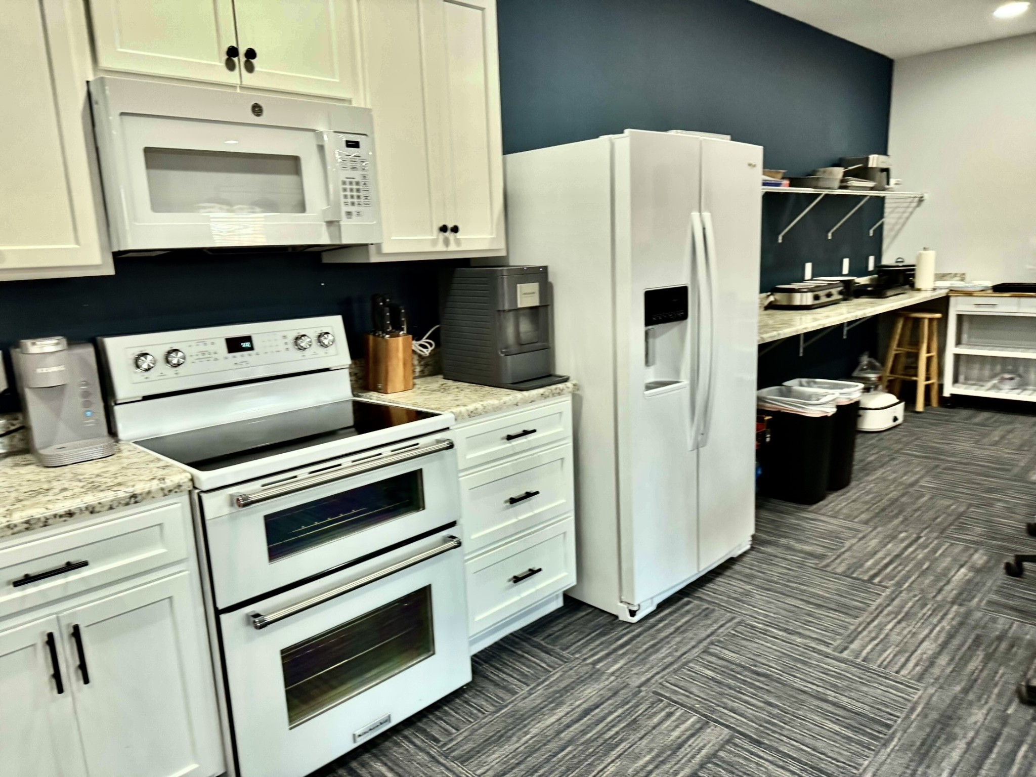 9461 Short Mountain Road Smithville, TN 37166 - Photo 14 of 26 a kitchen with stainless steel appliances a stove a refrigerator and cabinets