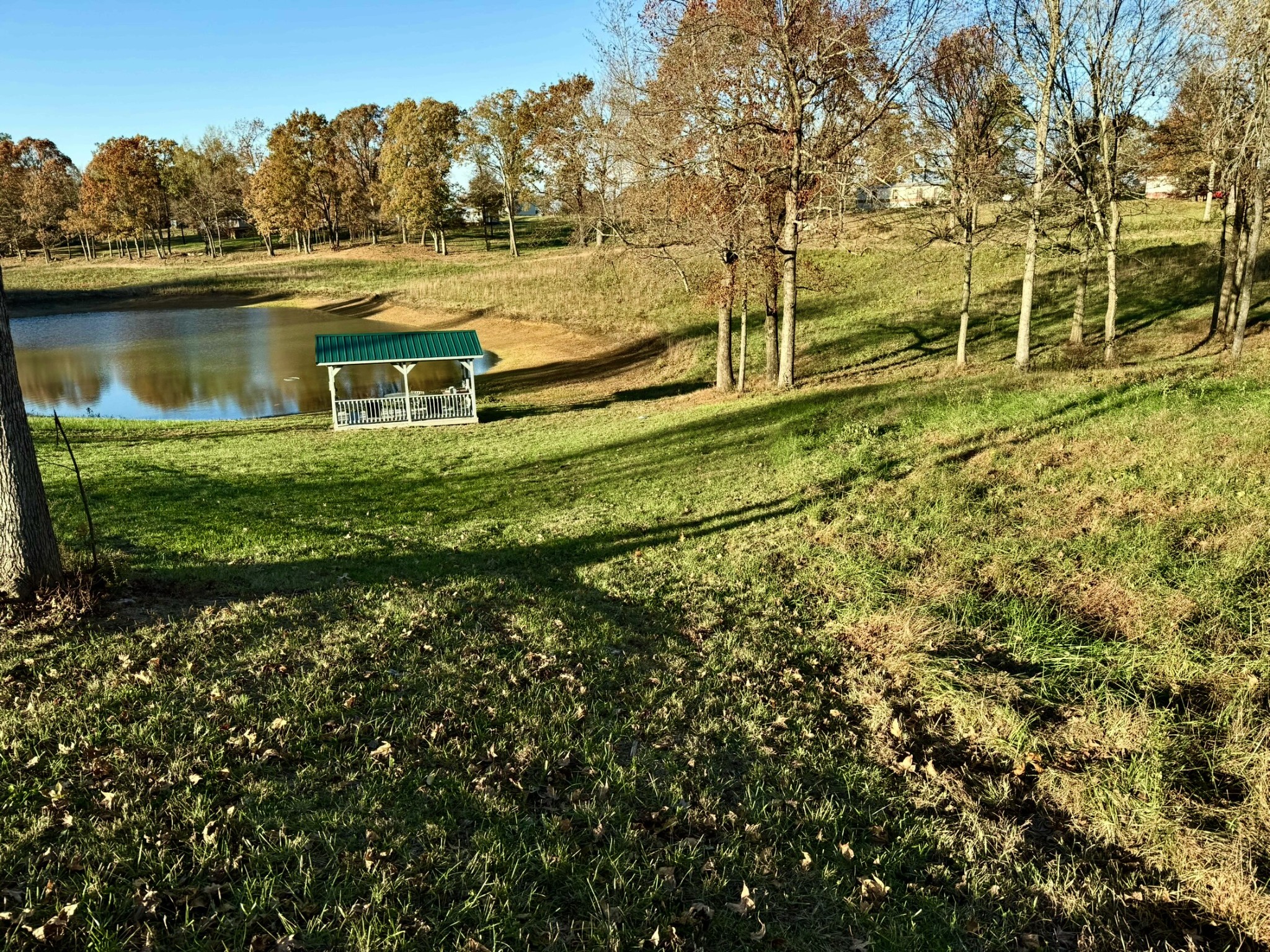 9461 Short Mountain Road Smithville, TN 37166 - Photo 17 of 26 a view of a lake with a house in the background