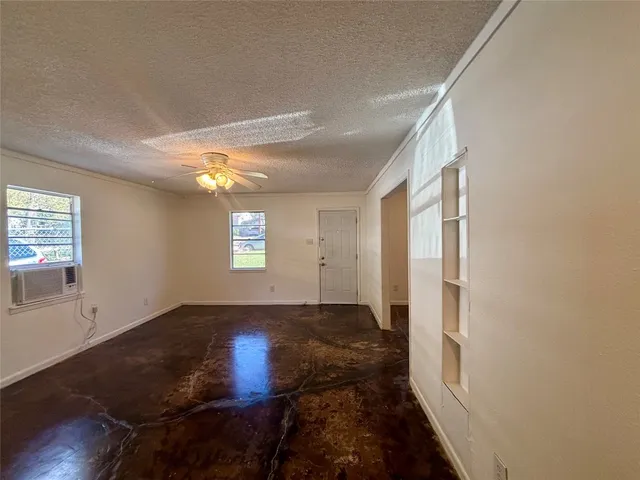 a view of an empty room and window