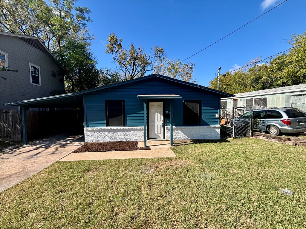 1606 Singleton Avenue Austin, TX 78702 - Photo 19 of 25 a front view of a house with a yard