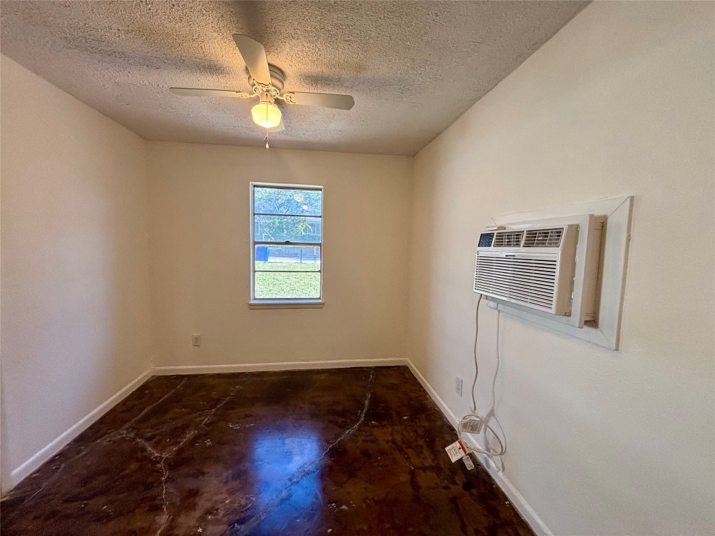 1606 Singleton Avenue Austin, TX 78702 - Photo 9 of 25 a view of a livingroom with wooden floor and a ceiling fan