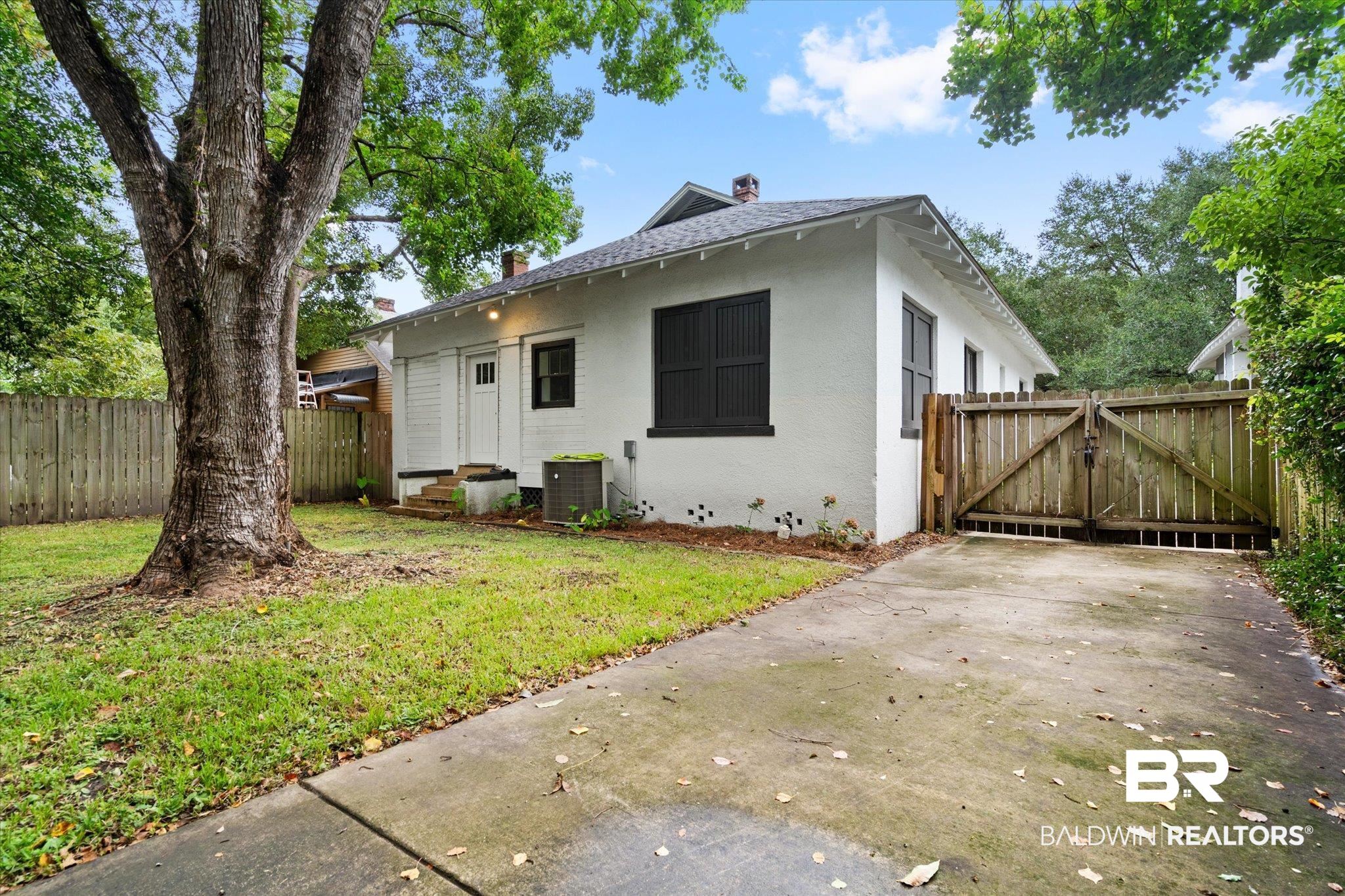308 South Ann Street Mobile, AL 36604 - Photo 28 of 30 Bungalow featuring cooling unit, a front yard, and a patio