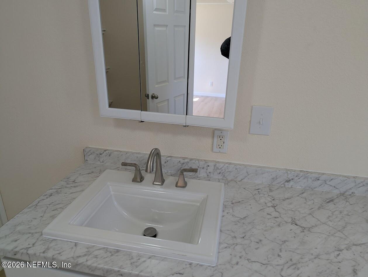 119 Walter Avenue Interlachen, FL 32148 - Photo 16 of 21 a bathroom with a sink and a mirror