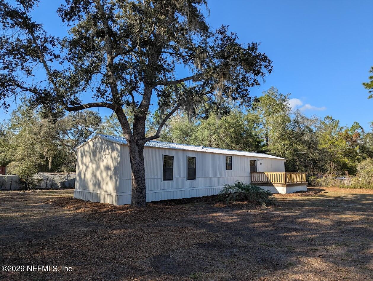 119 Walter Avenue Interlachen, FL 32148 - Photo 6 of 21 a view of a house with a tree