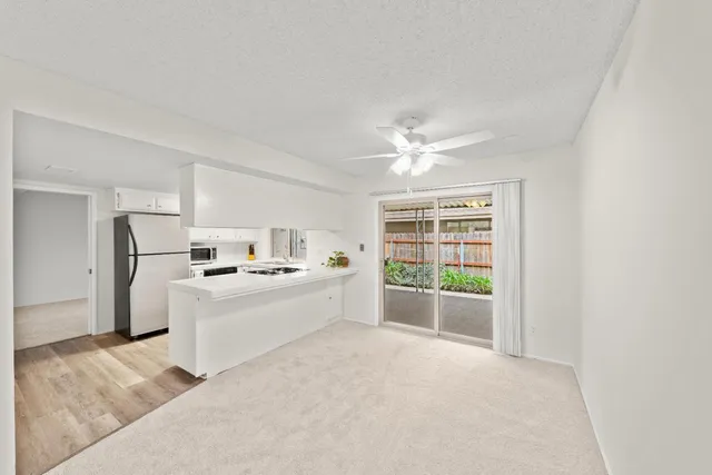 a view of a bedroom with furniture and natural light