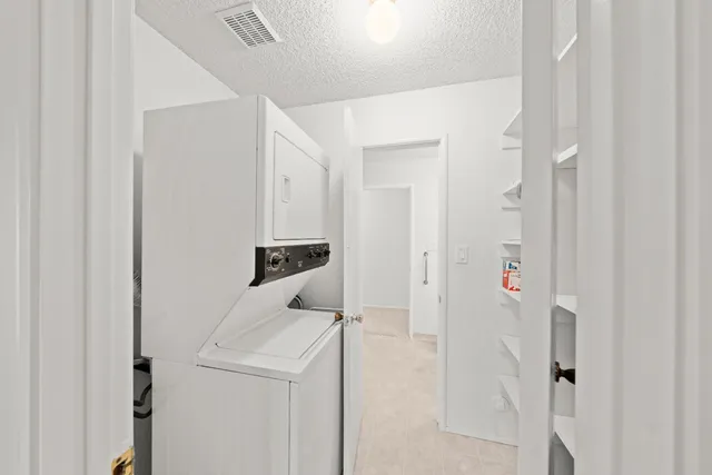 a view of a hallway with staircase